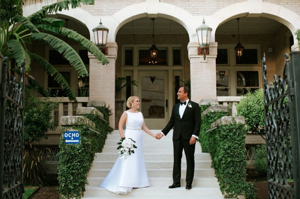 hotel havana wedding with glamorous bride and groom on front steps